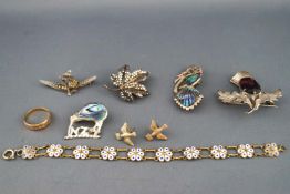 A selection of five sterling silver brooches together with a hallmarked 15ct gold rose cut diamond