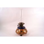 A Victorian earthenware oil lamp decorated in the Imari palette with a Palmer & Co Duplex burner,