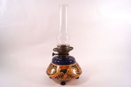 A Victorian earthenware oil lamp decorated in the Imari palette with a Palmer & Co Duplex burner,