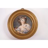 A 19th century French portrait miniature of a Lady with a dove, watercolour on ivory,
