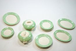 An Art Deco dinner service with green and white spotted design, six person setting,