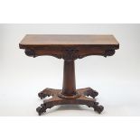 A William IV rosewood card table on tapering cylindrical pedestal on waisted rectangular base with