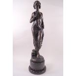 An art Nouveau bronze of a maiden holding a posy of flowers,