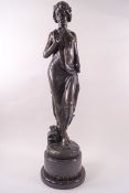 An art Nouveau bronze of a maiden holding a posy of flowers,