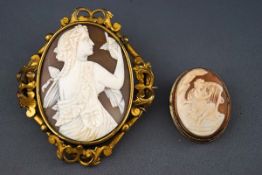 A Victorian gilt metal and shell cameo oval brooch depicting a neo-classical maiden admiring