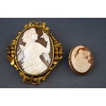 A Victorian gilt metal and shell cameo oval brooch depicting a neo-classical maiden admiring