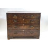 A George III mahogany chest of two short over three long drawers, brass oval ring handles,