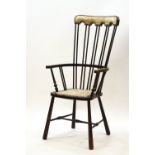 A 19th century elm stick back chair with copper studded upholstered seat and headrest,