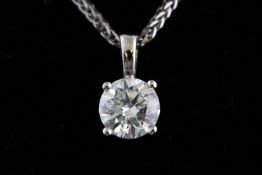 A white metal single stone diamond pendant. Stated to be 0.74ct.