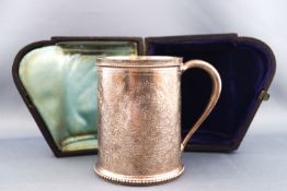 A Victorian silver Christening mug, with beaded rim and foot,