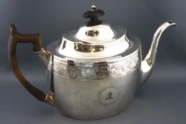 A George III silver tea pot,