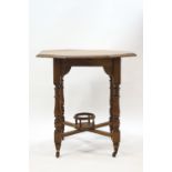 A Victorian oak octagonal occasional table with undershelf on turned legs joined by an X-frame