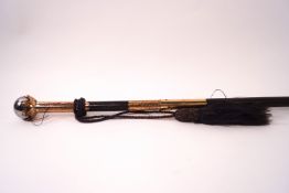 A ladies walking cane with engraved gilt metal mounts and decorative ball knop