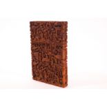 A Chinese wooden card case, carved in low relief with figures and pagodas, 11.5cm x 7.