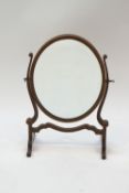 An Edwardian oval swing frame mirror, 39.