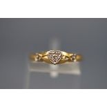 An 18 carat gold single stone diamond ring set with one illusion set round brilliant cut diamond.