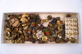A collection of Military buttons and other buttons, badges, medal ribbons and a 1939-1945 Star.