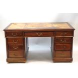 An Edwardian mahogany pedestal desk,