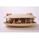 A late 19th century carved ivory clam-shaped ornament,