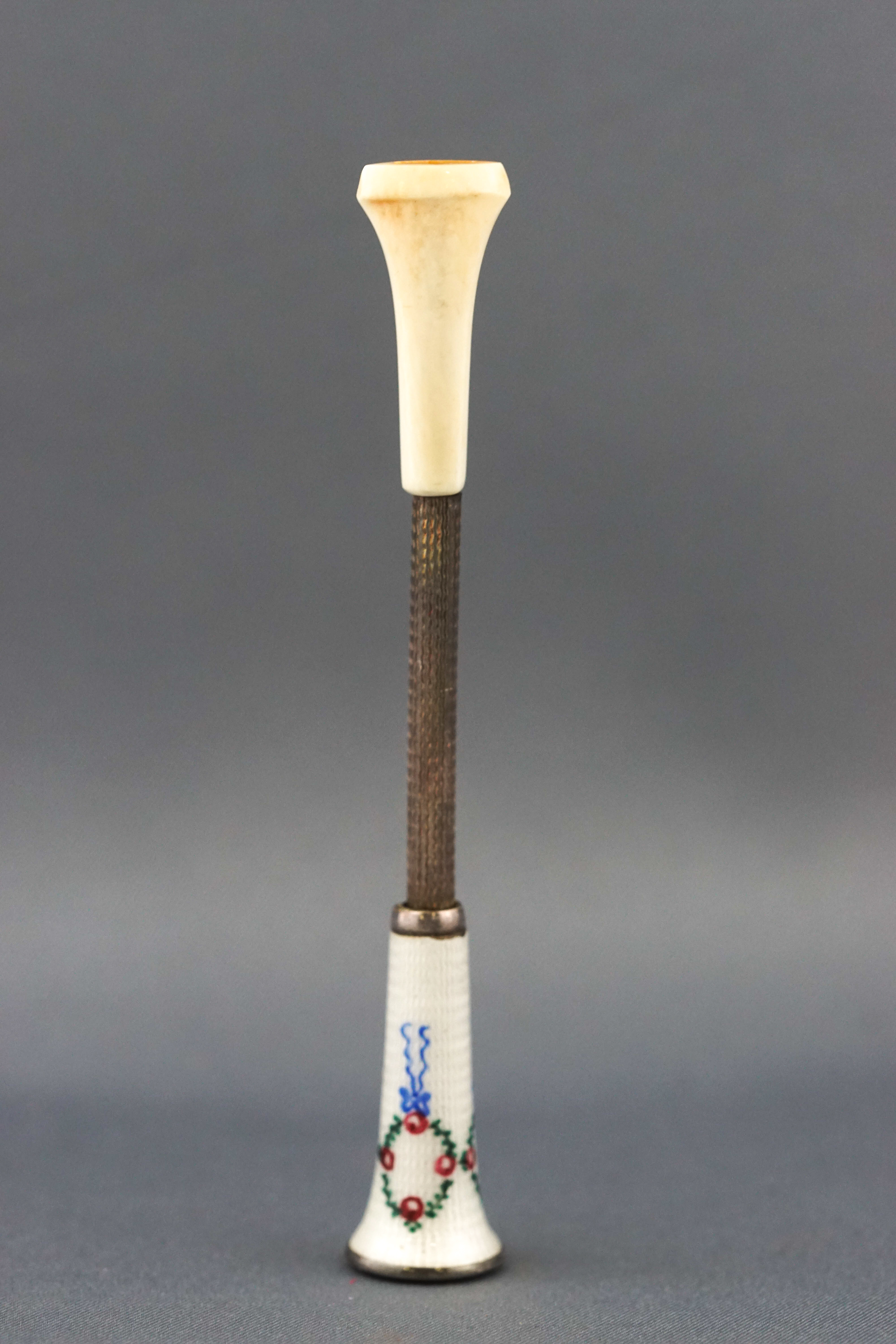 An Edwardian Austrian silver and enamel cigarette holder