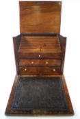 A late 19th century burr walnut stationery cabinet with lidded top and drop down leather inset