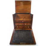 A late 19th century burr walnut stationery cabinet with lidded top and drop down leather inset