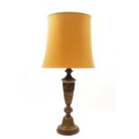 A 20th century large patinated bronze table lamp with central band of 'Archaic' decoration in