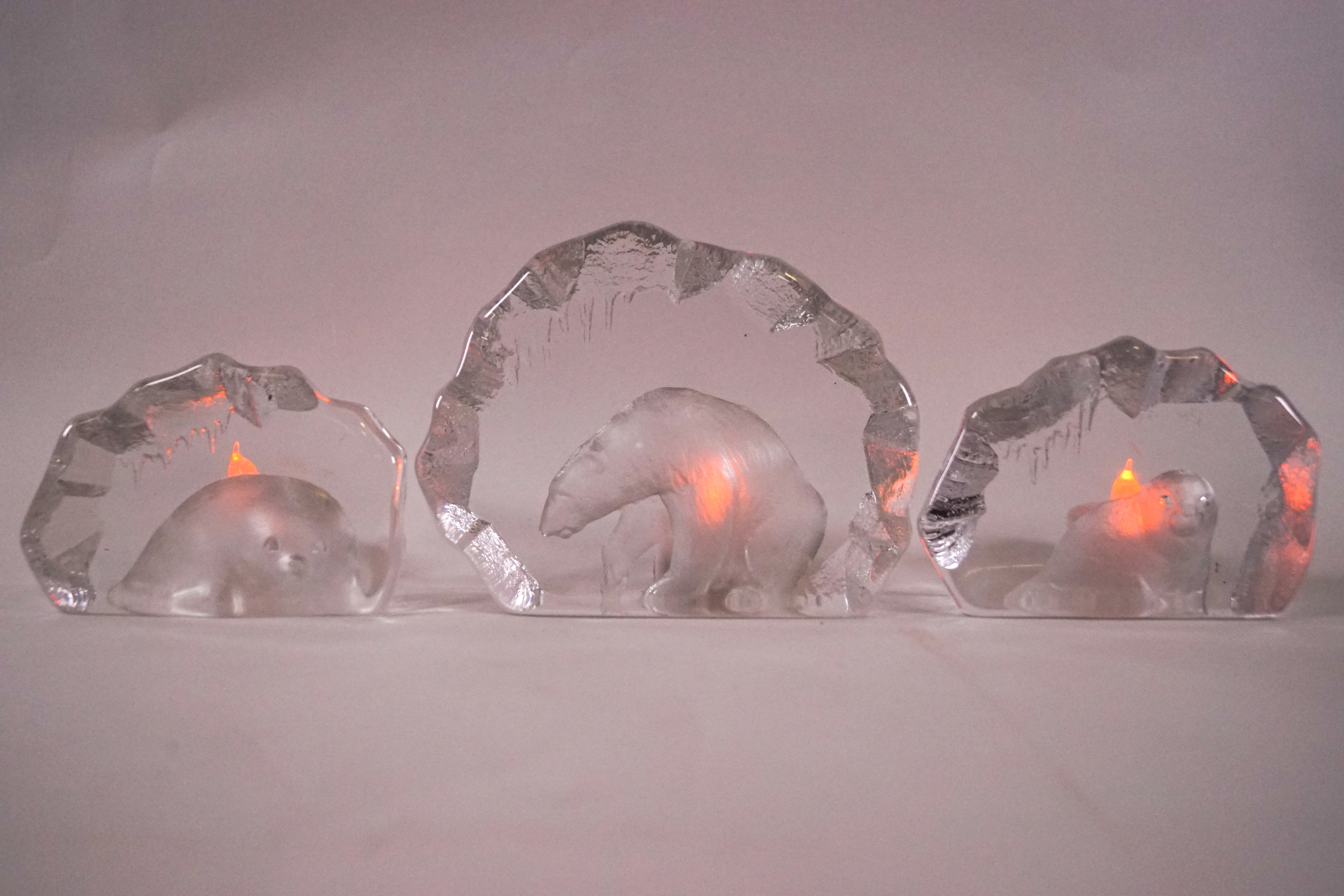 Three Swedish glass paperweights, two depicting seals, signed, 8.