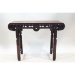 A 20th century Chinese hardwood alter table with scroll ends and carved detail, 84.