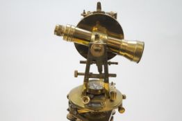 An early 20th century brass precision surveying level on tripod by F.W.