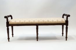 An Adams style mahogany window seat carved with Classical motifs,