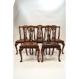 A set of five George III style mahogany dining chairs,