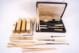 A collection of Victorian mounted clothes brushes, glove stretchers,