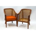 A pair of mid-20th century tub shaped Bergere chairs,