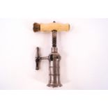 A 19th Century rack and pinion corkscrew with turned ivory handle and brush,