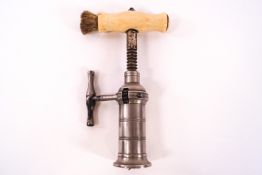 A 19th Century rack and pinion corkscrew with turned ivory handle and brush,