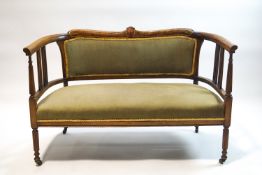 An Edwardian inlaid mahogany salon suite, comprising a two seat sofa,