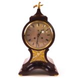 A 19th century mahogany balloon shaped mantel clock, the eight day movement with bell strike,