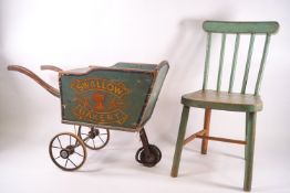 A Victorian child's painted wooden Swallow Bakery cart, 36cm high x 51cm wide x 23cm deep,