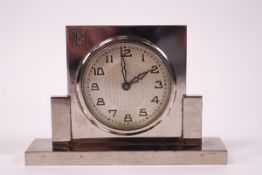 An Art Deco chrome bedside clock, monogrammed FGM,