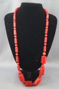 An Art Deco style necklace in the form of alternate graduated round beads and hexagonal-cylinders