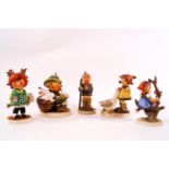 Five Goebel Hummel figures including a red headed girl holding a bunch of flowers