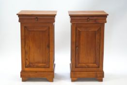 A pair of French bedside cupboards, each with a drawer stamped J C Nicol, 75cm high x 41.