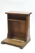 A small Victorian oak lectern with under-shelf and panel front,