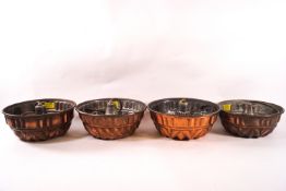 Four copper plated jelly moulds,
