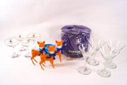 A collection of Babycham memorabilia including a an ice cooler two sets of four glasses,