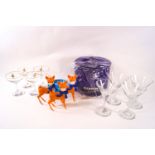 A collection of Babycham memorabilia including a an ice cooler two sets of four glasses,