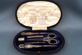 An Edwardian silver handled sewing set in fitted case, Birmingham 1904 and 1905,