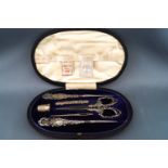 An Edwardian silver handled sewing set in fitted case, Birmingham 1904 and 1905,