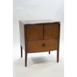 A George III mahogany bow front commode with cupboard doors, on square tapering legs,